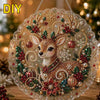 A detailed Christmas-themed diamond painting suncatcher featuring a deer surrounded by sparkling pearls and greenery.
