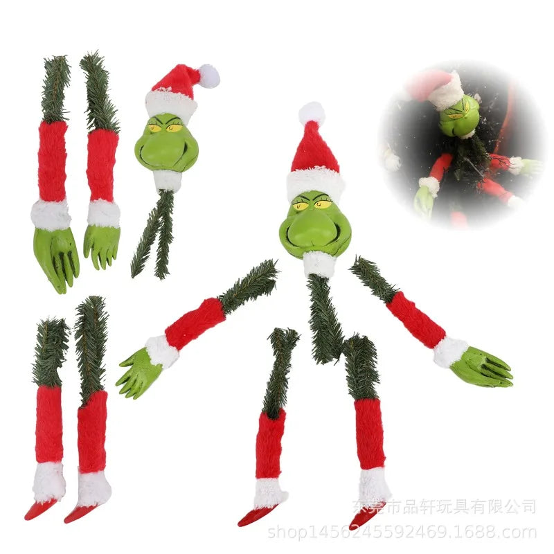 Green monster Christmas wall decor featuring a festive green and red creature with elf-like features