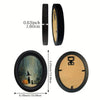 Oval wall art featuring a witch and black cat in a woodland scene with a black frame