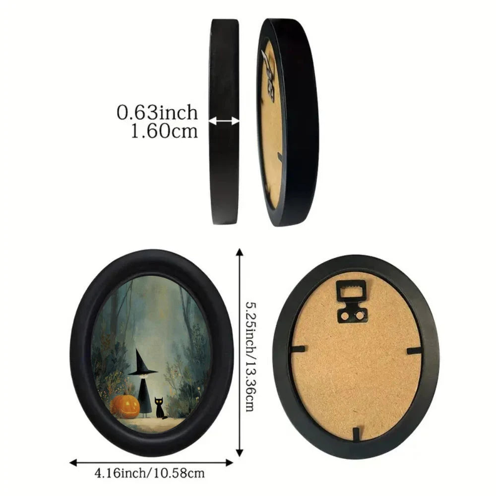 Oval wall art featuring a witch and black cat in a woodland scene with a black frame