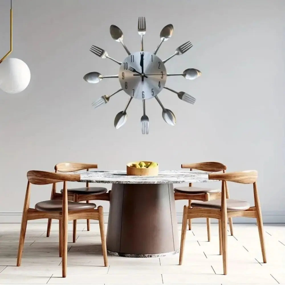 A modern cutlery 3D wall clock featuring silver forks arranged in a circular design above a wooden dining table.