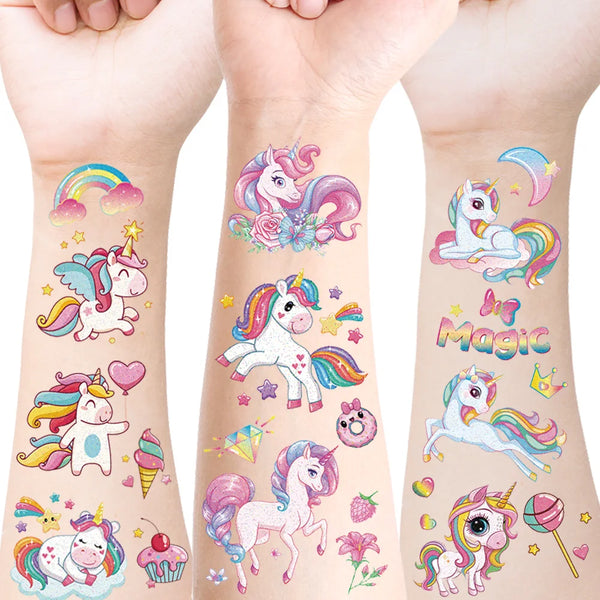 Colorful unicorn temporary tattoos on a person's arm showing various designs and rainbows