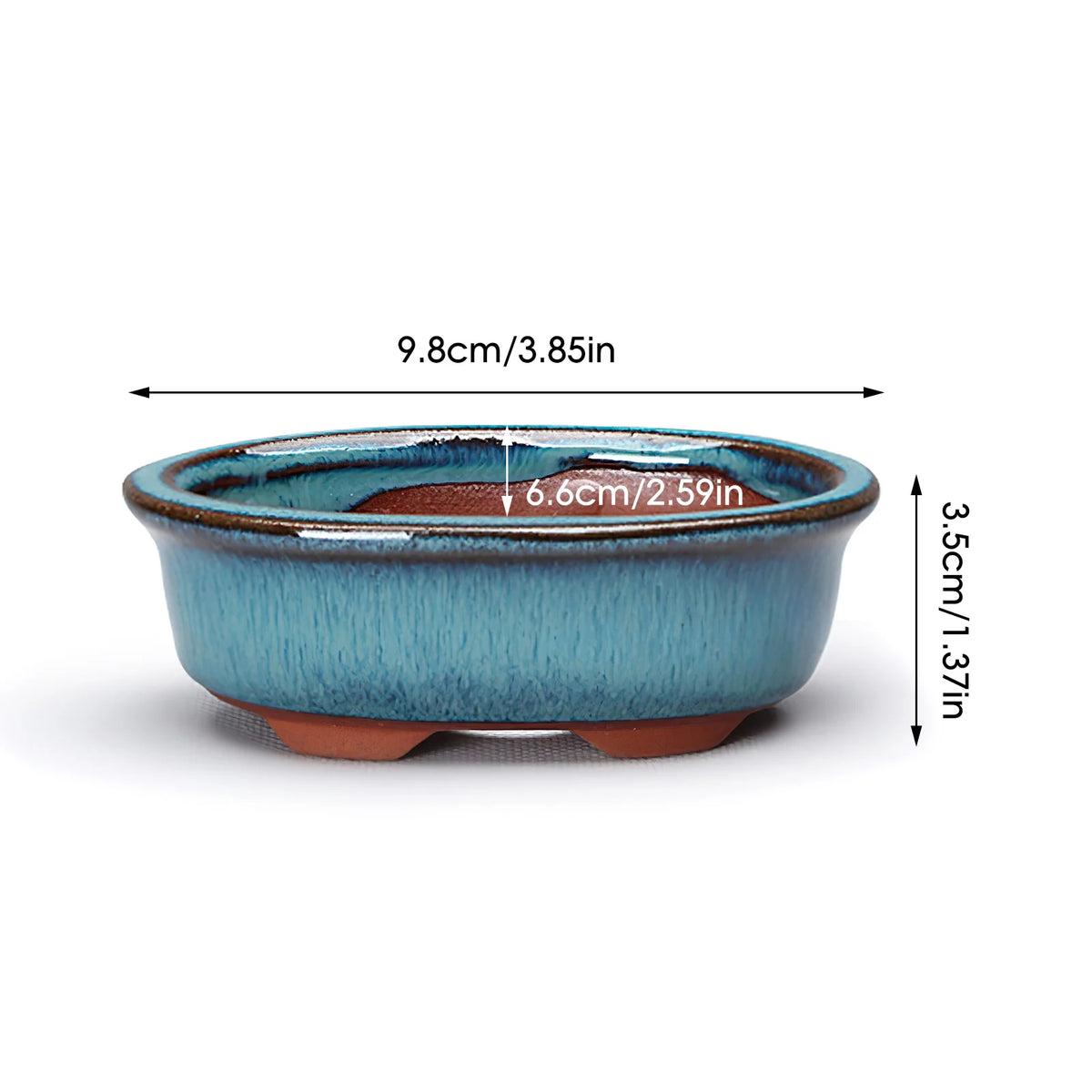 A blue ceramic succulent planter with an earthy rim and drainage hole, shown from above.
