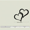 Black metal wall decor featuring two interlocking heart shapes, with dimensions of 12 inches by 30 cm.