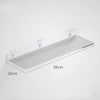Clear acrylic floating shelf with wall mounts shown against a white wall.