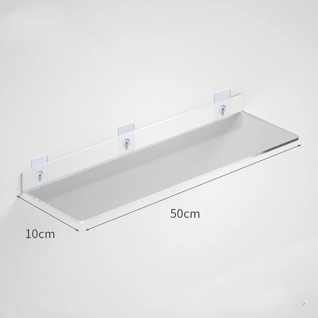 Clear acrylic floating shelf with wall mounts shown against a white wall.
