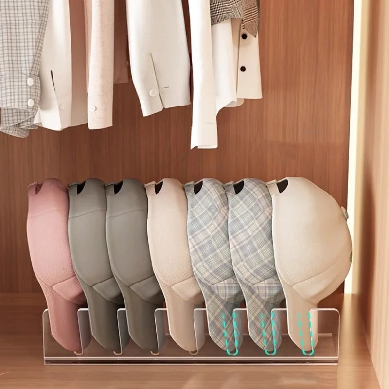 Acrylic cap storage rack displaying several light pink and beige acrylic caps.