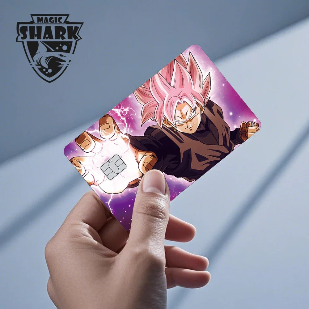 A hand holds a Dragon Ball Super Saiyan card skin sticker featuring Goku in a Super Saiyan form against a purple background.