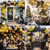 A black and gold confetti balloon garland arch kit featuring balloons and decor for an event.