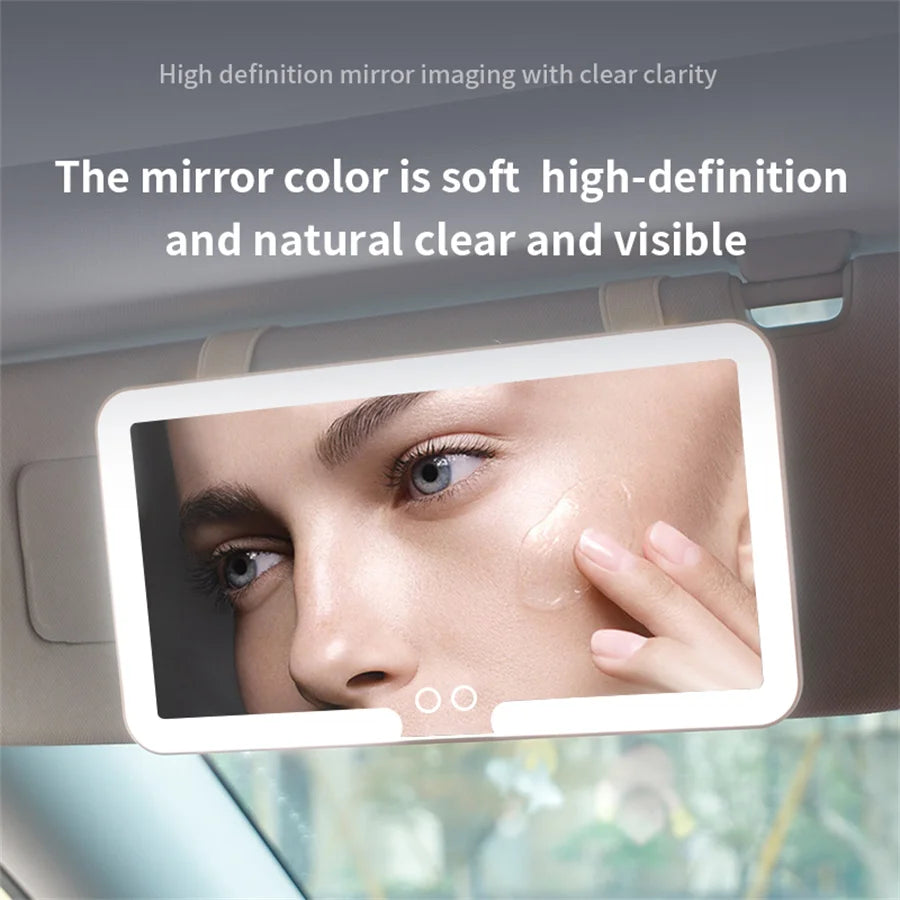 A vanity mirror mounted in a car sun visor showing a woman's face with soft, high-definition lighting.