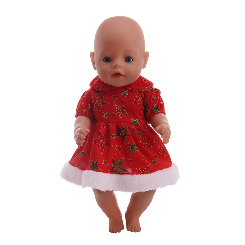 A baby doll wearing a red Christmas outfit with white trim and a fluffy white hem.