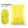 Bag of yellow lemon-colored resin rhinestones for crafting