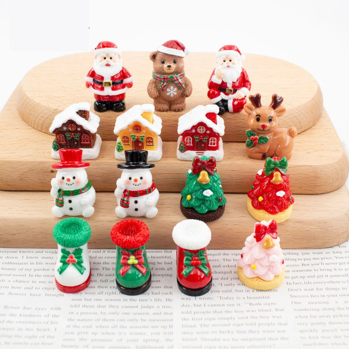 A set of festive Christmas resin decor featuring Santa figures, reindeer, and holiday ornaments.