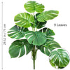Artificial Monstera plant with nine silk green leaves shown against a white background.