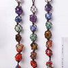 A string of natural crystal rolling stone pendants in various colors and shapes.