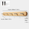 Solid beech wood wall hook rack with four wooden hooks for hanging items.