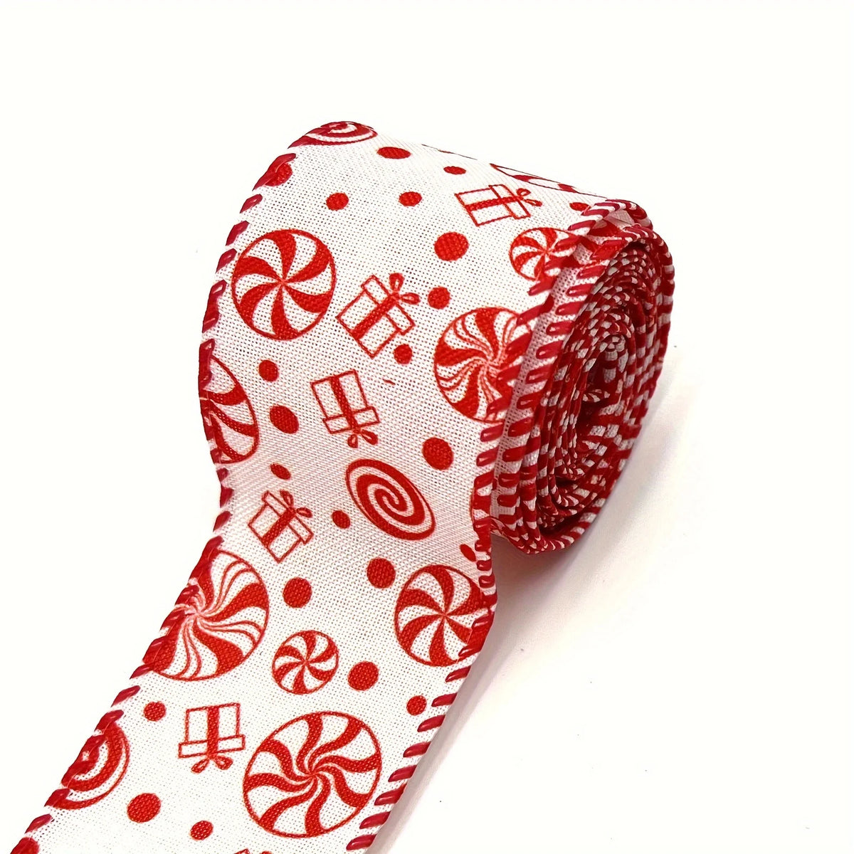 Red and white candy cane pattern burlap ribbon rolled for Christmas crafting or wrapping.