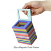 A hand holds a stack of 20 magnetic photo frames in various pastel colors.