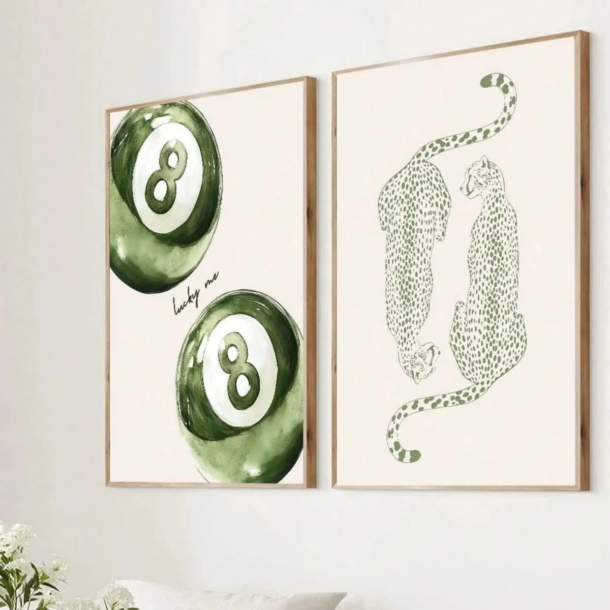 A set of two canvas prints featuring a sage green cheetah and pool ball design on white backgrounds.