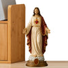 A religious figurine set depicting Jesus and the Blessed Mother with a heart symbol.