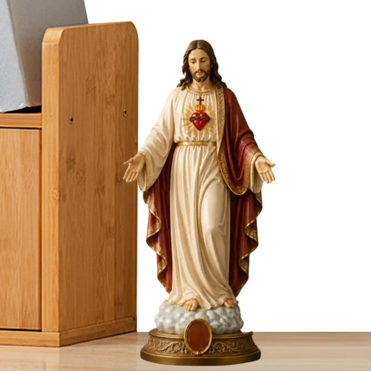 A religious figurine set depicting Jesus and the Blessed Mother with a heart symbol.