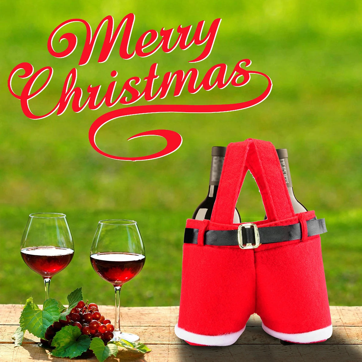 A pair of red festive Santa Claus gift bags with black straps and white soles are displayed in a green outdoor setting.