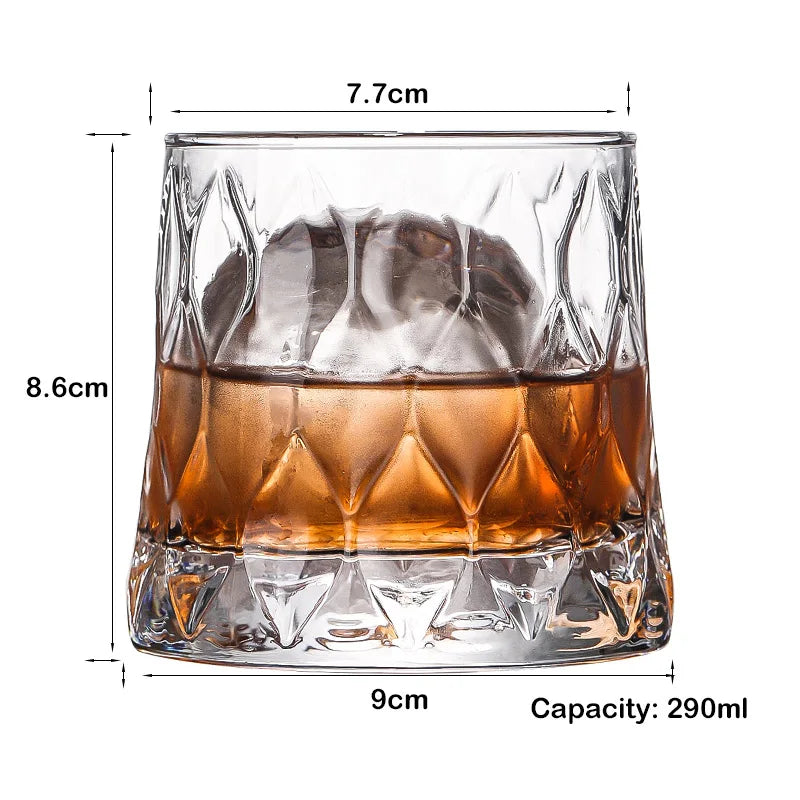 A clear whiskey glass with a heavy base, showing liquid and dimensions.