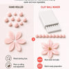 A set of clay ball makers and hand rolled clay balls demonstrating various sizes for detailed shaping.