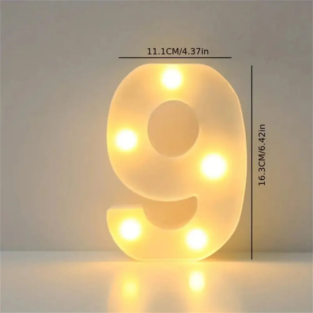 A glowing yellow LED letter light shaped like the number 9, used for cozy room or party decor.