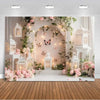 A dreamy photo backdrop featuring an arched floral display with butterflies and ornate white lanterns for events.