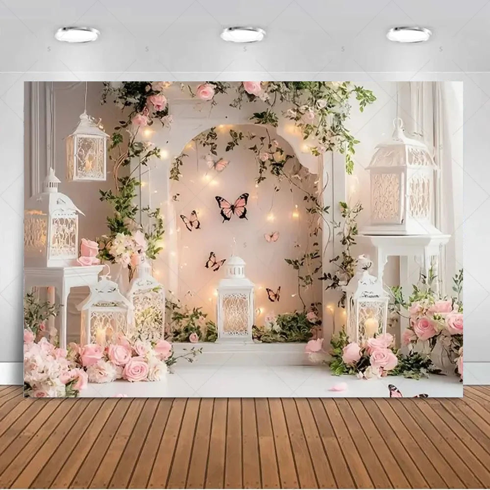 A dreamy photo backdrop featuring an arched floral display with butterflies and ornate white lanterns for events.