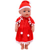 A baby doll wearing a red Santa hat and a matching red outfit with white trim and pom-poms.
