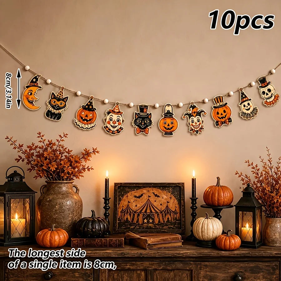 A string of vintage wooden Halloween decorations featuring pumpkins, ghosts, and moons displayed on a wall.