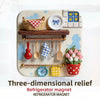 Three-dimensional relief refrigerator magnet featuring a woven basket, wooden utensils, and floral elements.