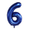 A large, dark blue foil number balloon shaped like the number 6 for party decor.