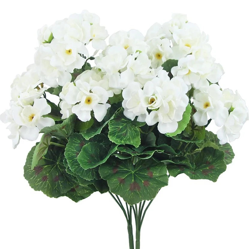 A bouquet of white silk begonia artificial flowers with green leaves.