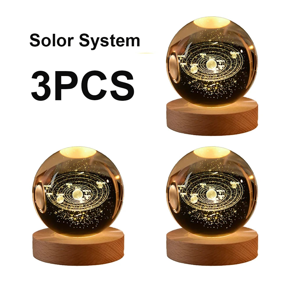 Three galaxy crystal ball night lights with wooden bases