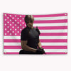 A banner featuring the design of the American flag with pink and white stripes and stars.