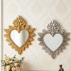 Ornate flame wall mirror featuring a heart shape with gold and silver leaf detailing.