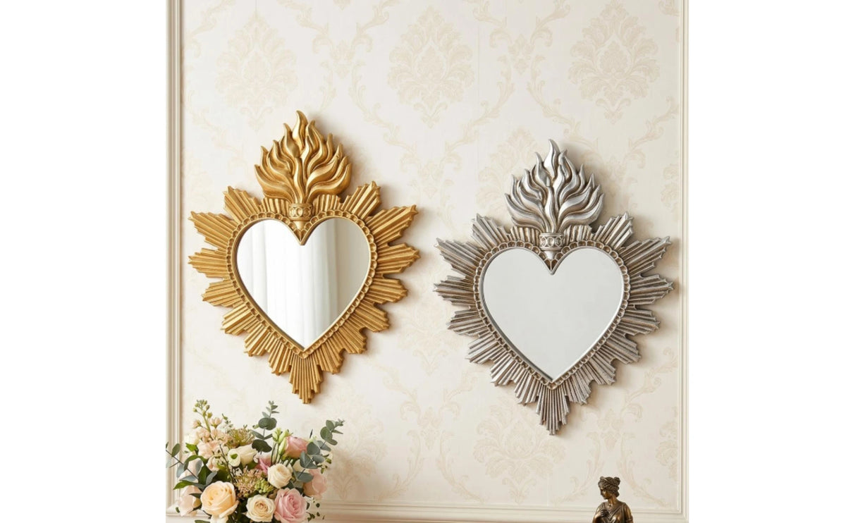 Ornate flame wall mirror featuring a heart shape with gold and silver leaf detailing.