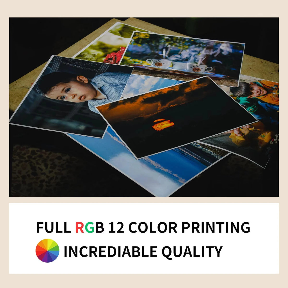 A collection of diverse photographic prints displayed on a wooden surface.