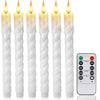 A set of six white tapered flameless LED taper candles standing upright.