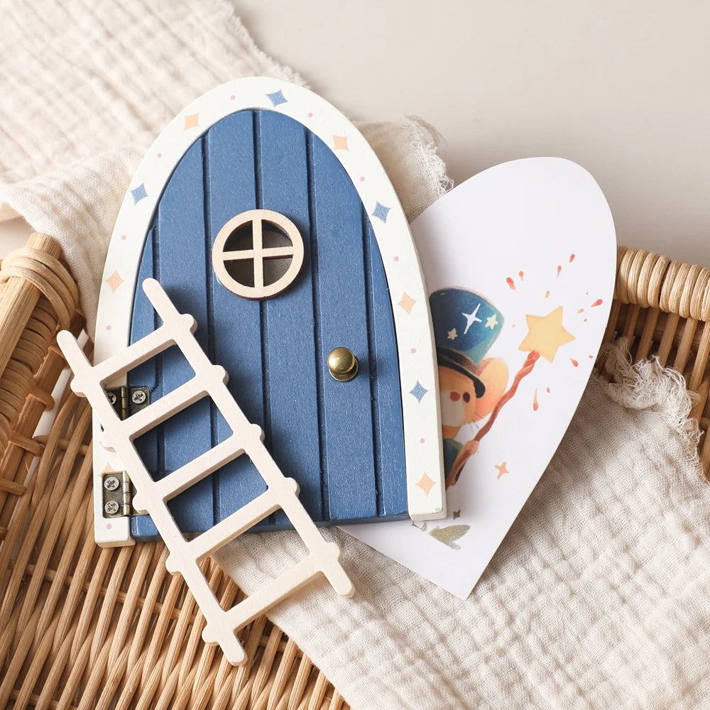 A wooden fairy elf door miniature decoration featuring a blue arched door and a wooden ladder.