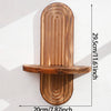 A vertical wooden wall shelf with a rounded, ribbed design mounted on a white wall.