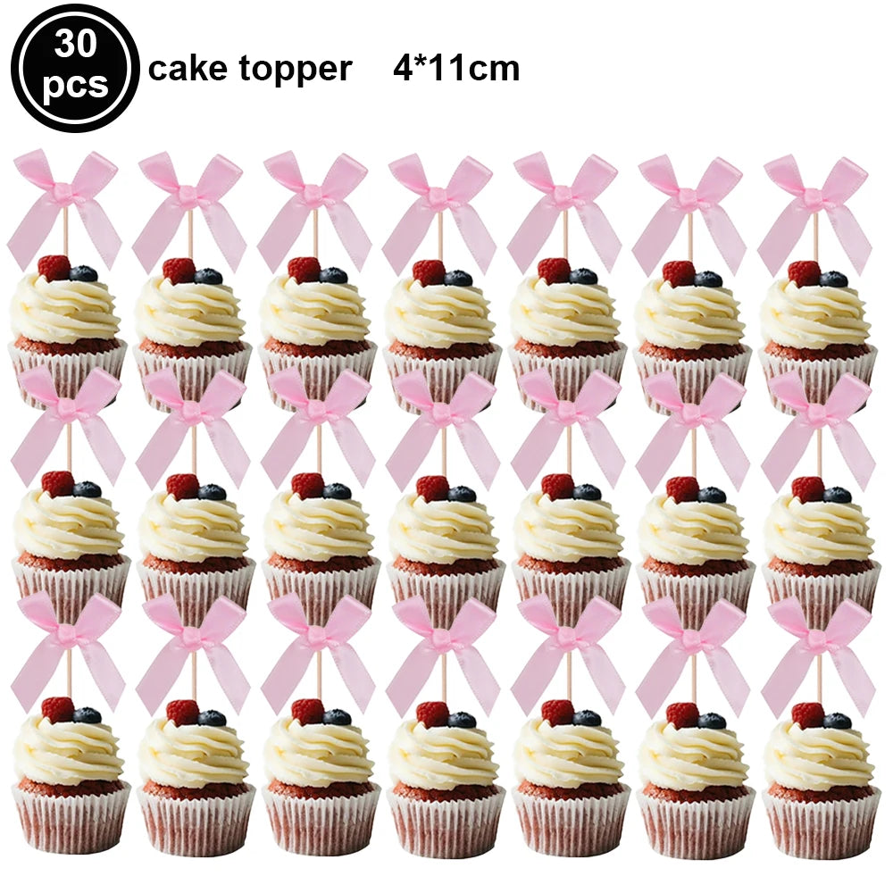 A set of 30 pink bow cupcake toppers measuring 4x11cm.