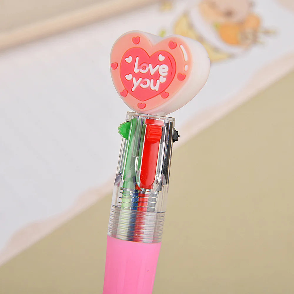 A pink heart-shaped ballpoint pen with a 'love you' design and multiple colored tips.