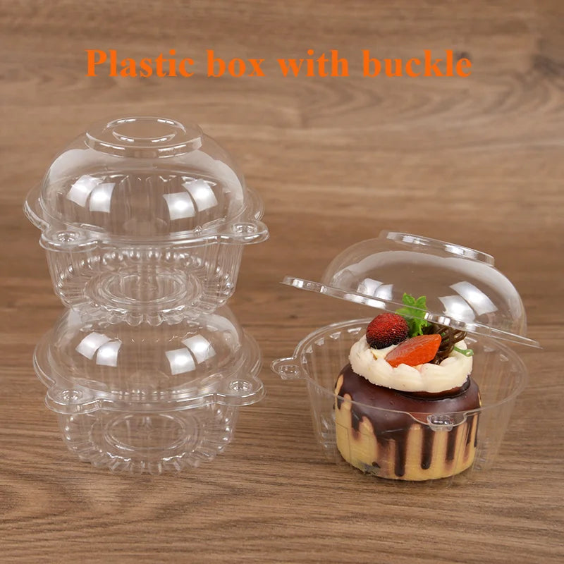 Clear plastic box with a buckle holding a small dessert or cake.