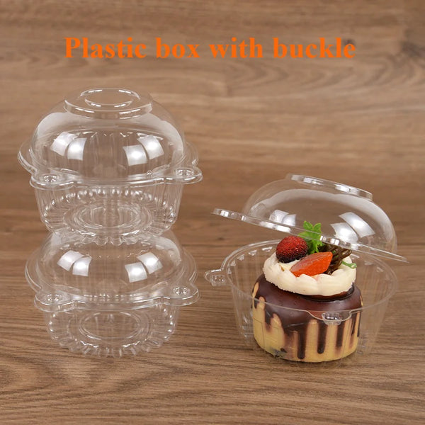 Clear plastic box with a buckle holding a small dessert or cake.