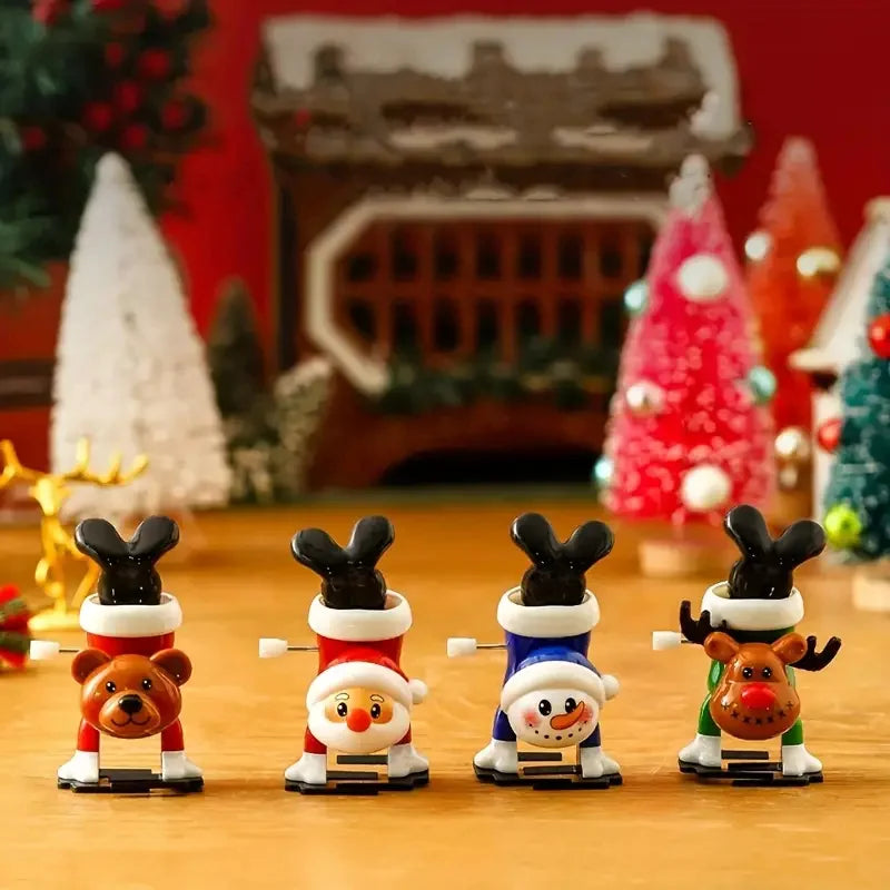A collection of clockwork wind-up figurines featuring festive animal characters like a bear, fox, and deer.