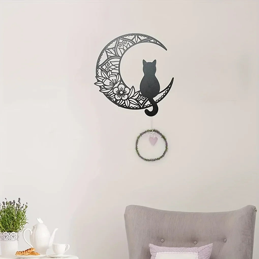 Black cat silhouette inside a crescent moon outline wall decor sculpture with a hanging heart.